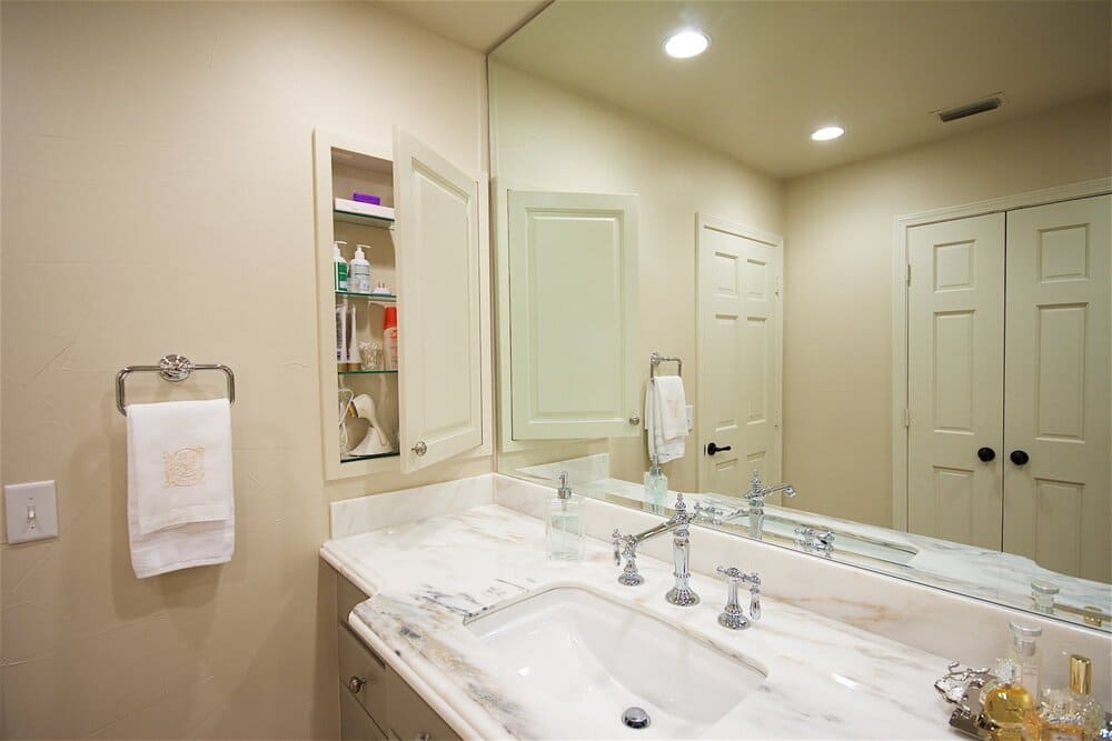 Large Mirror Above Giant Marble White Single Sink