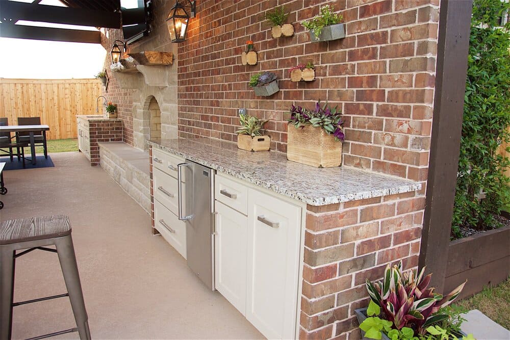 Outdoor Brick Food Prep Station with Stainless Steel Mini-Fridge and Brick Backsplash