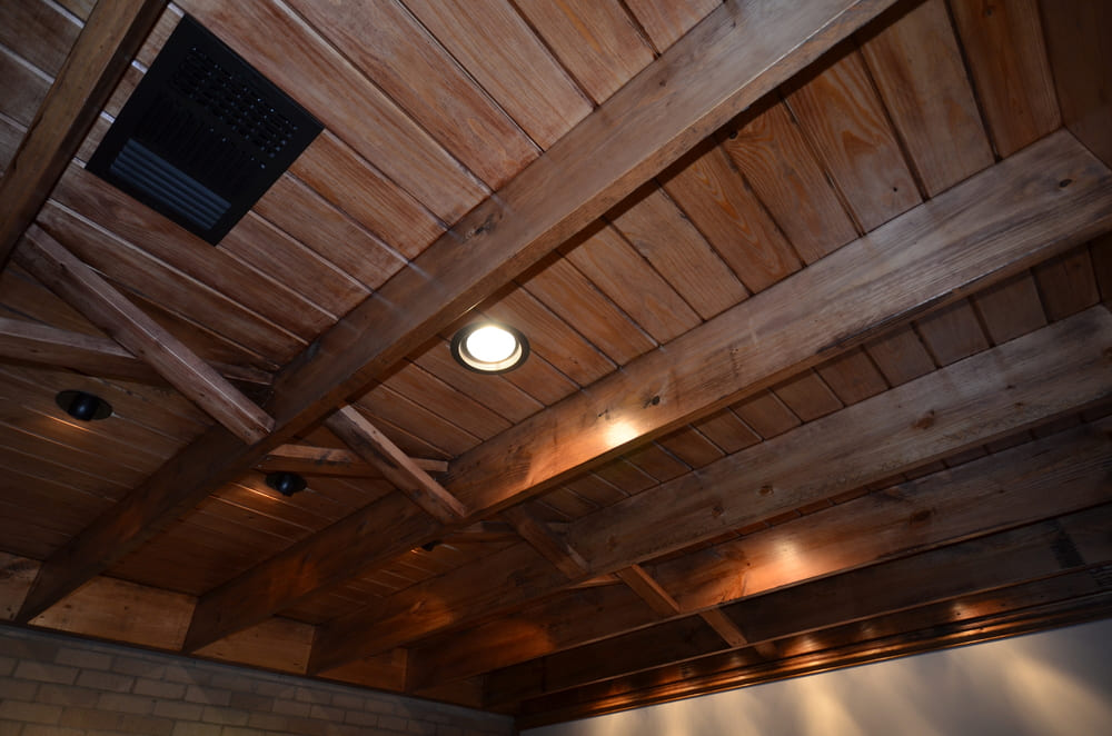 Dark Wooden Ceiling with Multiple Wooden Trusses