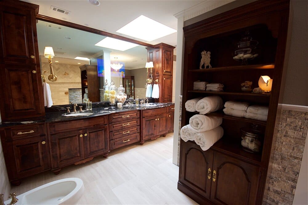 Large Bathroom Vanity with White Towels and Dark Wood Sink with Tons of Storage Space and Large Mirror